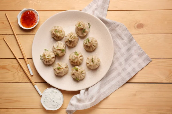 Plate Tasty Dumplings Sauces Wooden Table — Stock Photo, Image