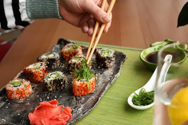 Woman Eating Tasty Sushi Rolls Cafe — Stock Photo, Image