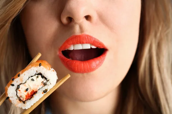 Woman Eating Tasty Sushi Roll Closeup — Stock Photo, Image