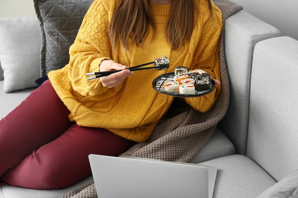 Woman Eating Tasty Sushi Rolls Home — Stock Photo, Image