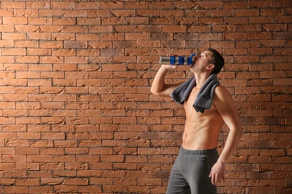 Sporty Young Man Bottle Water Brick Wall — Stock Photo, Image