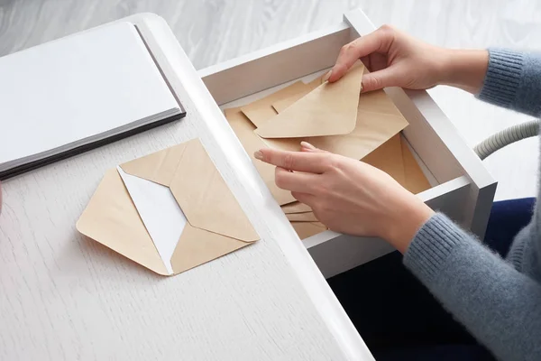 Young Woman Taking Envelope Table Drawer — Stock Photo, Image