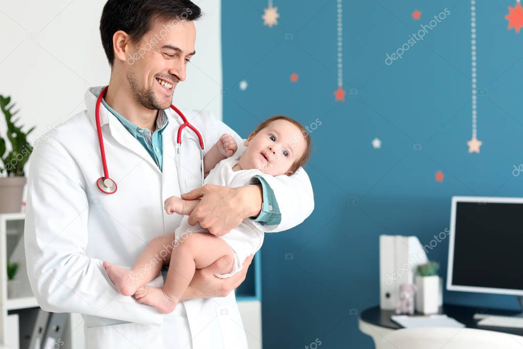 Pediatrician with little baby in clinic