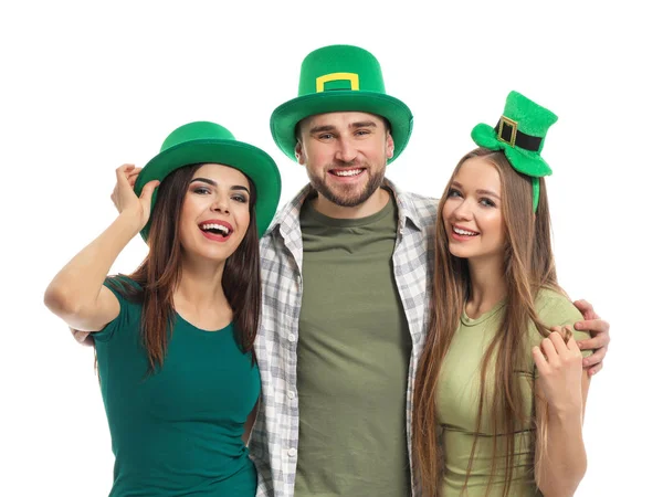 Young people in green hats on white background. St. Patrick\'s Day celebration
