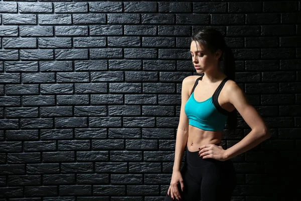 Sporty Young Woman Dark Brick Wall — Stock Photo, Image