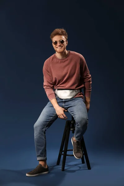 Fashionable Young Man Sitting Stool Color Background — Stock Photo, Image