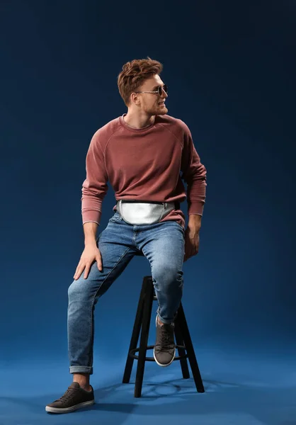 Fashionable Young Man Sitting Stool Color Background — Stock Photo, Image