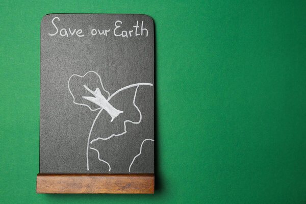Chalkboard with picture and text SAVE OUR EARTH on color background