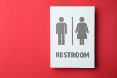 Unisex restroom sign board on color background. Concept of transgender clipart