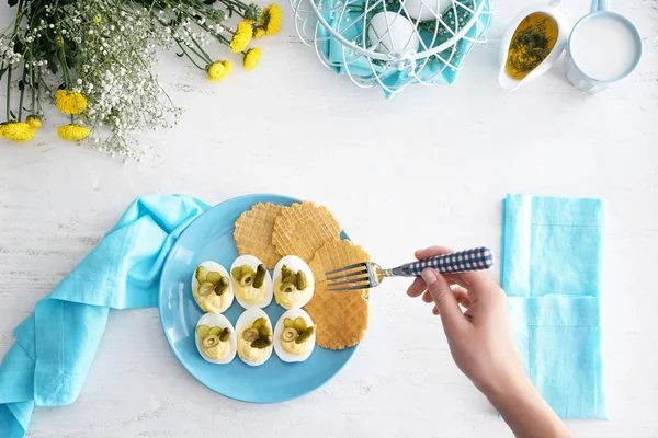 Woman Eating Tasty Deviled Eggs White Table — Stock Photo, Image