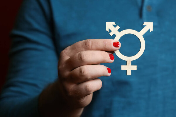 Man with manicure showing symbol of transgender, closeup