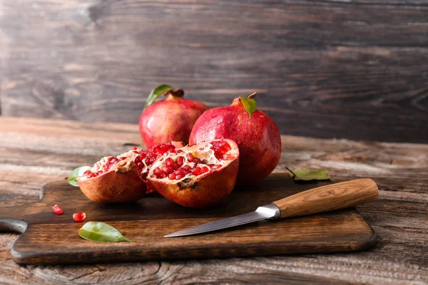 Cutting Board Ripe Pomegranates Knife Wooden Table — Stock Photo, Image