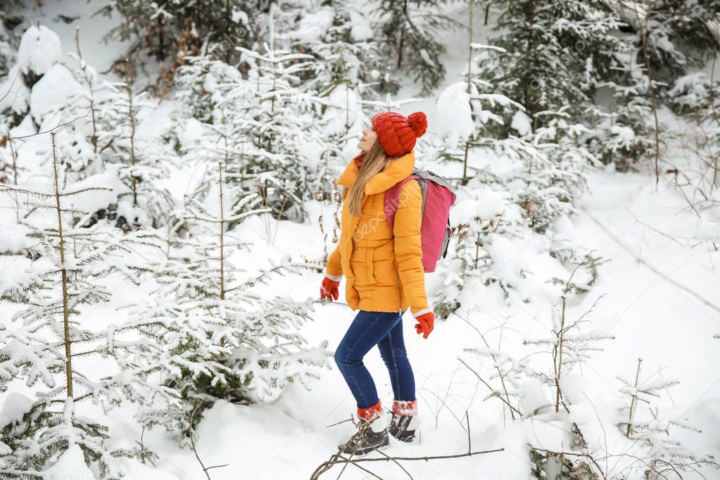 Beautiful woman in winter forest