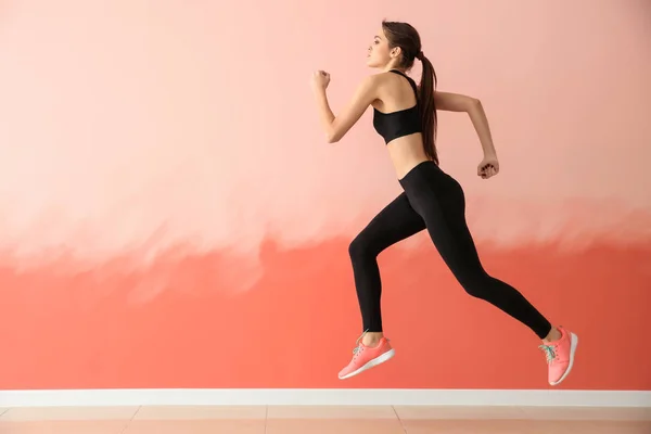 Sporty Young Woman Running Color Wall — Stock Photo, Image