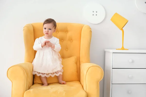 Cute Baby Girl Standing Armchair — Stock Photo, Image