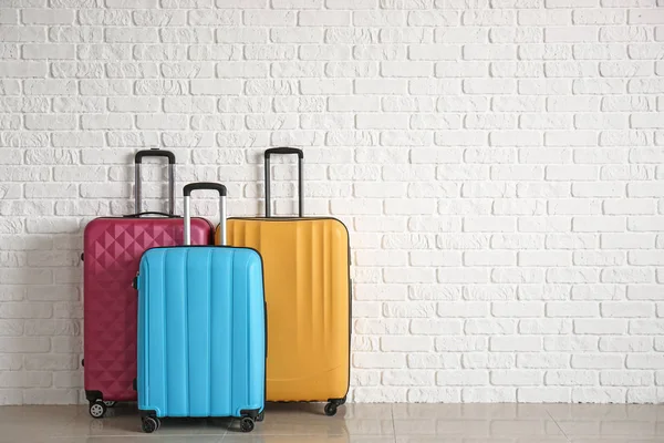 Packed Suitcases White Brick Wall — Stock Photo, Image