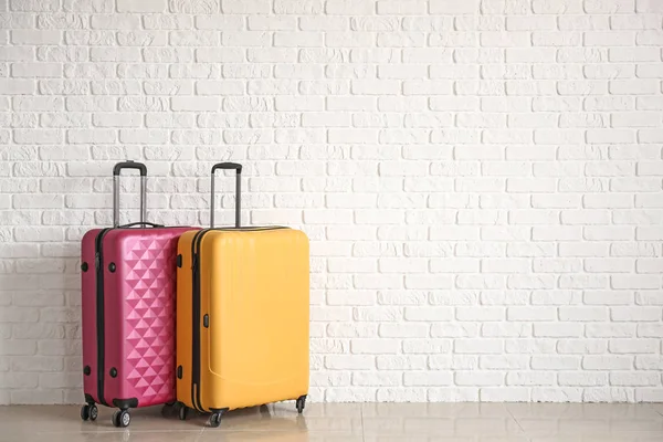 Packed Suitcases White Brick Wall — Stock Photo, Image