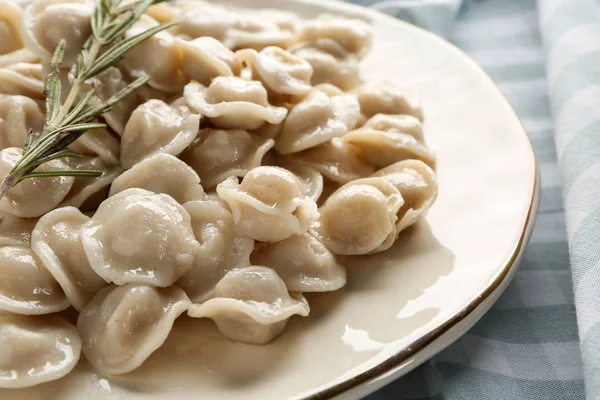 Plate with tasty dumplings on table, closeup — Stock Photo, Image