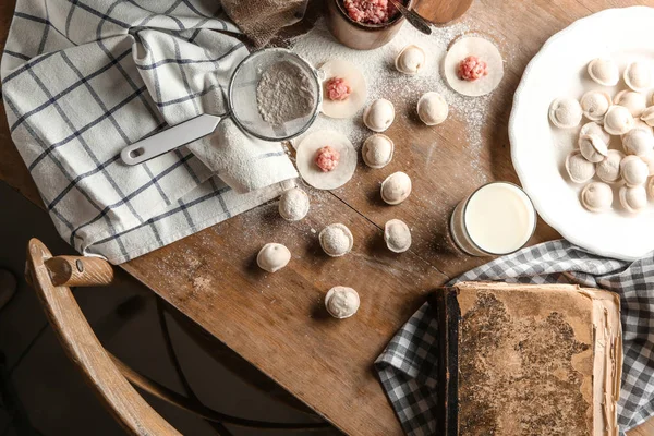 Composition with raw dumplings on table — Stock Photo, Image