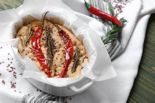 Baking dish with tasty Italian focaccia on wooden table — Stock Photo, Image