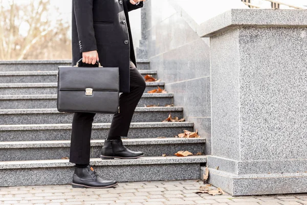 Businessman with stylish briefcase near stairs outdoors
