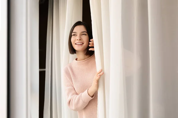 Young woman near window in morning — Stock Photo, Image