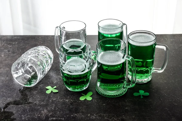 Mugs of green beer on table. St. Patrick's Day celebration — Stock Photo, Image