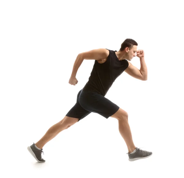 Спортивний молодий чоловік біжить на білому тлі — стокове фото