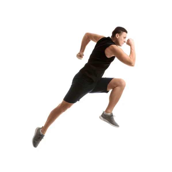 Sporty young man running against white background — Stock Photo, Image