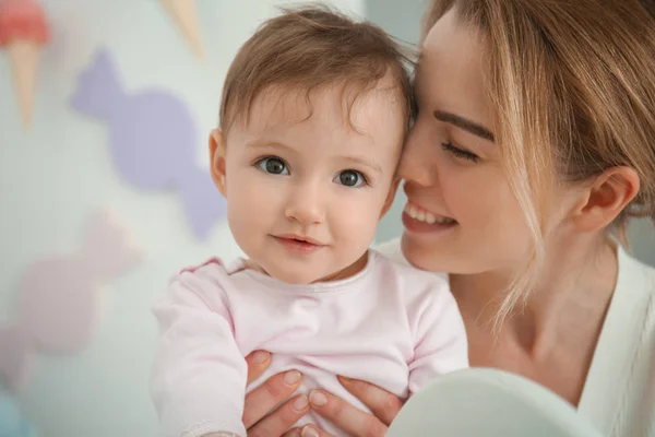 Mother with cute baby girl at home — Stock Photo, Image