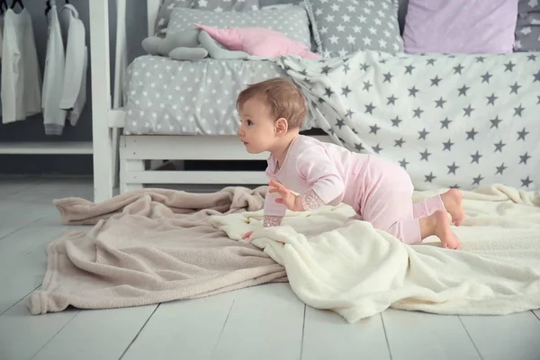 Cute baby girl crawling on floor — Stock Photo, Image