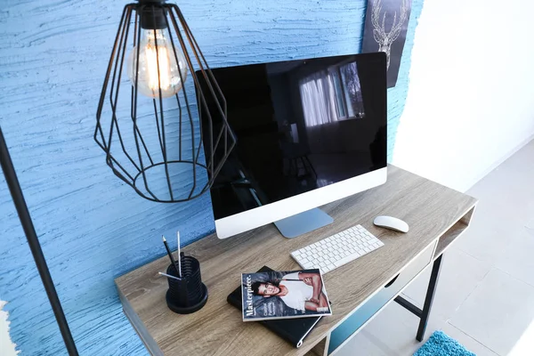 Stylish workplace with modern computer in interior of room — Stock Photo, Image