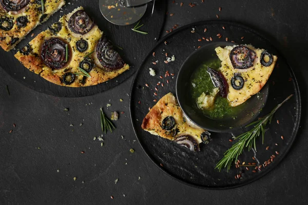 Tasty Italian focaccia with basil sauce on grey table — Stock Photo, Image