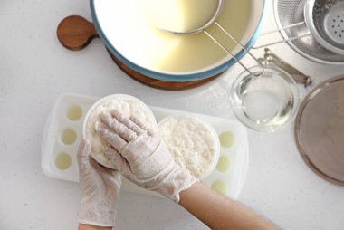 Woman preparing tasty cheese clipart