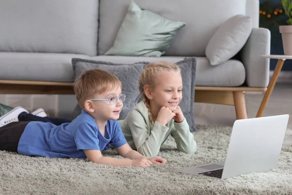 Cute little children watching cartoons at home — Stock Photo, Image