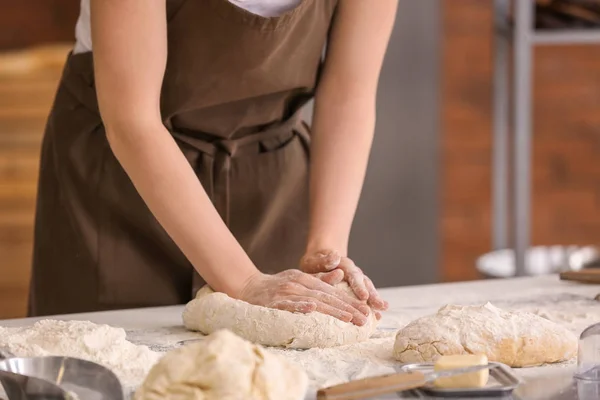 Female baker making dough in kitchen — Stock Photo, Image