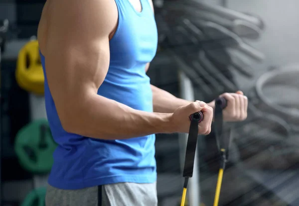 Young man training in modern gym — Stock Photo, Image