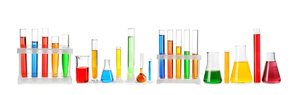 Laboratory glassware with color samples on white background — Stock Photo, Image