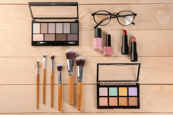 Flat lay composition with professional cosmetics on wooden background — Stock Photo, Image