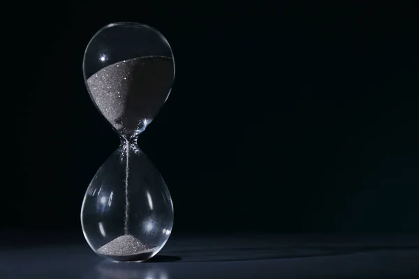 Crystal hourglass on dark background. Time management concept — Stock Photo, Image