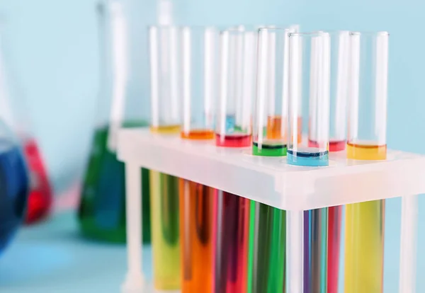 Test tubes with colorful samples in laboratory, closeup — Stock Photo, Image
