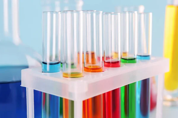 Test tubes with colorful samples in laboratory, closeup — Stock Photo, Image