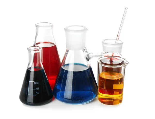 Chemical glassware with colorful liquids on white background — Stock Photo, Image