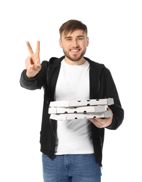 Giovane uomo con scatole di cartone pizza su sfondo bianco. Servizio di consegna cibo — Foto Stock