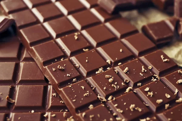 Tasty milk chocolate on table, closeup — Stock Photo, Image