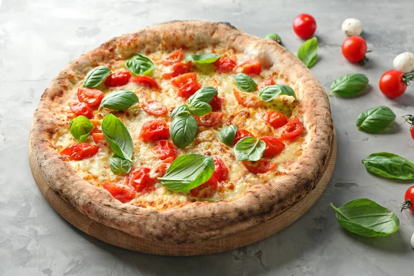 Delicious pizza on grey background — Stock Photo, Image