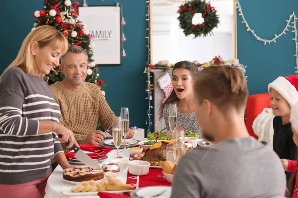 Happy family having Christmas dinner at home — Stock Photo, Image