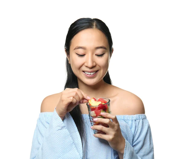 Asian woman with healthy fruit salad on white background — Stock Photo, Image