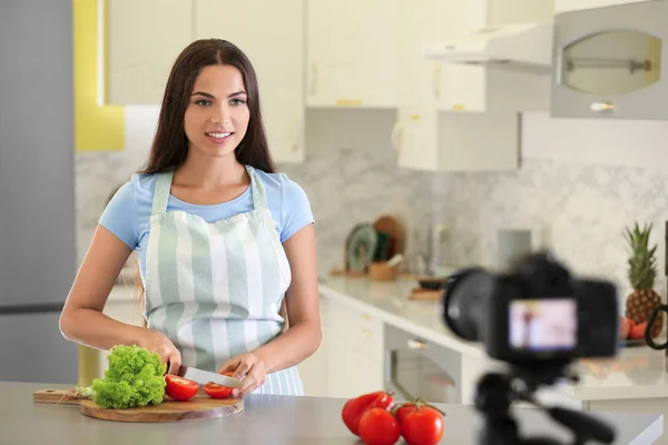 Young female food blogger recording video in kitchen — Stock Photo, Image