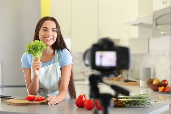 Young female food blogger recording video in kitchen — Stock Photo, Image